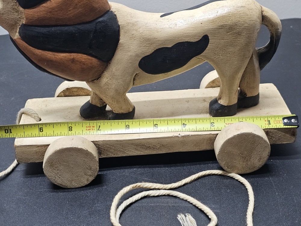 Antique Lion pull toy on wooden platform