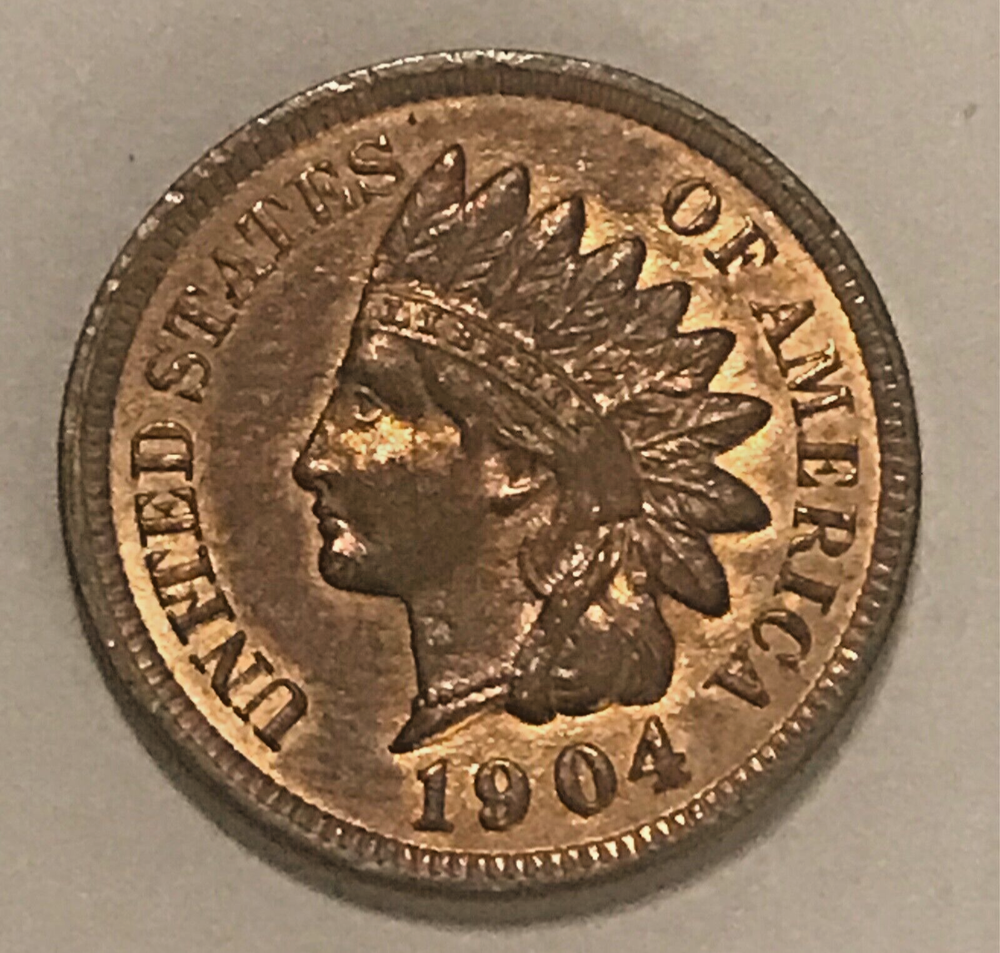 1904 Indian cent , uncirculated, mostly brown, some red remains