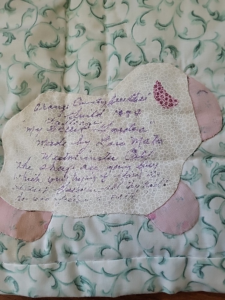 Handmade small quilt with a lamb appliqué pattern. 29"×29" Signed