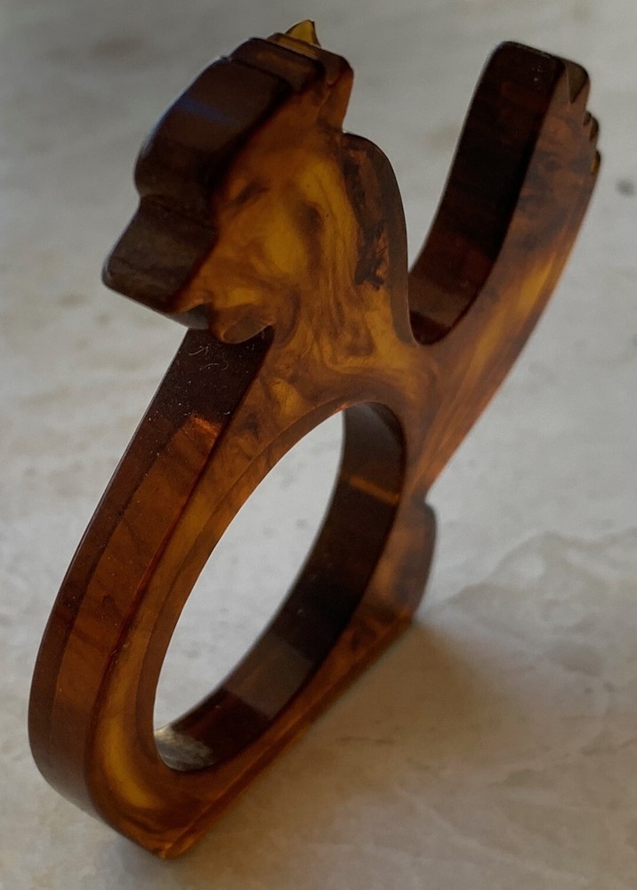 Swirled Bakelite Napkin Ring. Approximately 2 3/4" tall, 1/4" thick. Per piece.