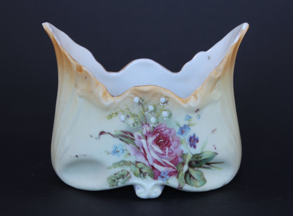 Vintage flared open sugar container with flowers on front. Unique shape