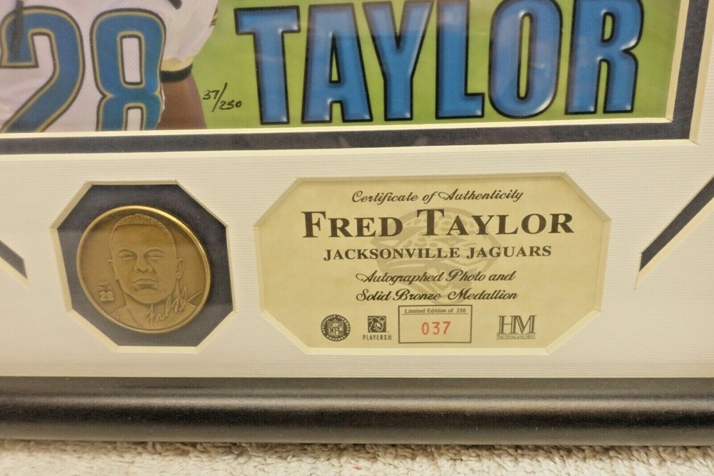 FRED TAYLOR AUTOGRAPHED PHOTO AND SOLID BRONZE MEDALLION LIMITED EDITION