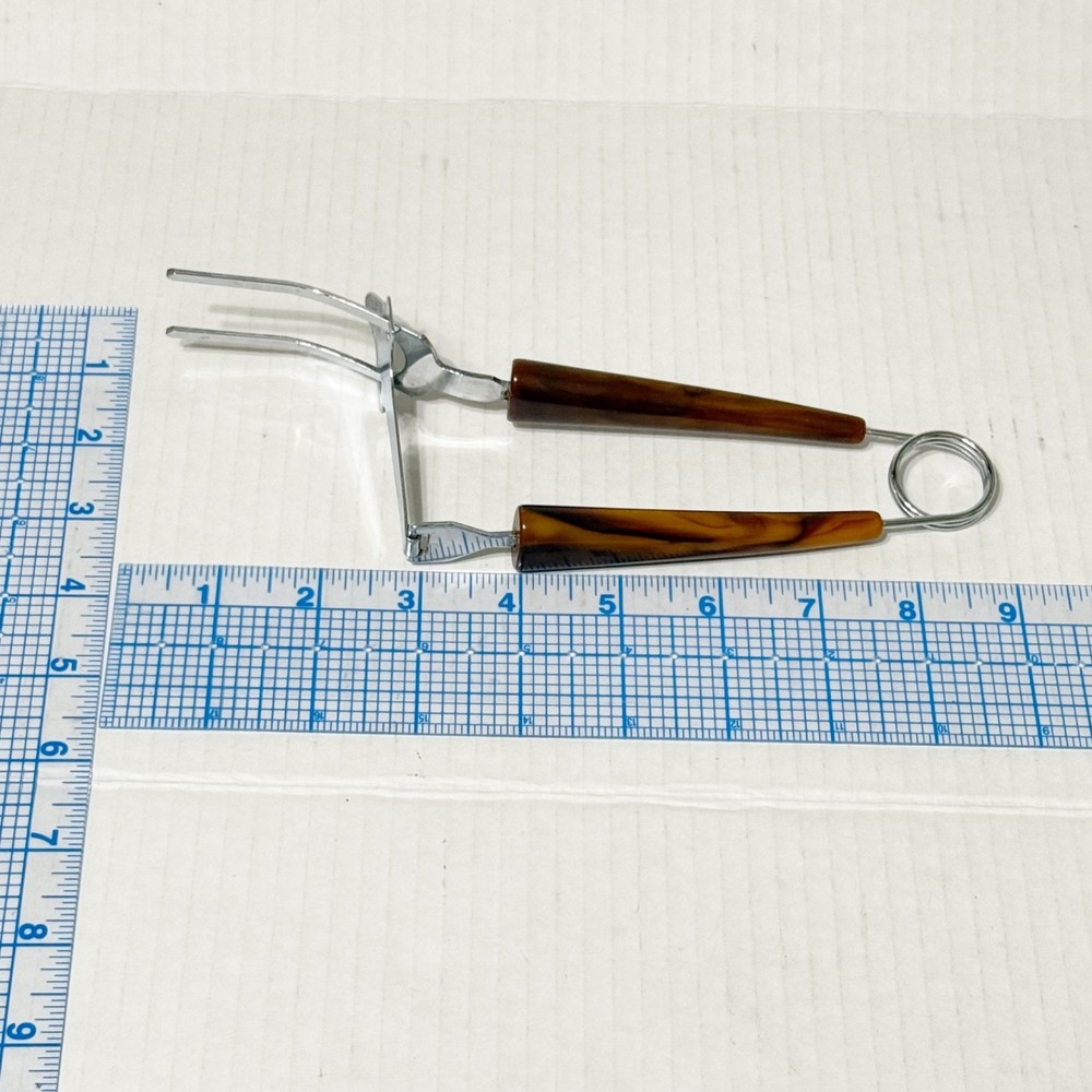 Vtg Two Prong Meat Server Tool with Bakelite Tortoiseshell Handles Springloaded