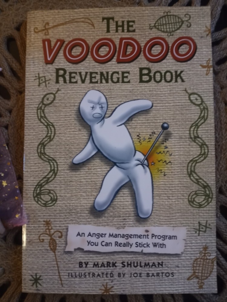 voodoo doll and book by Mark Schulman