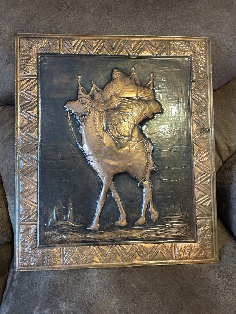 Middle Eastern repoussé metal wall plaque