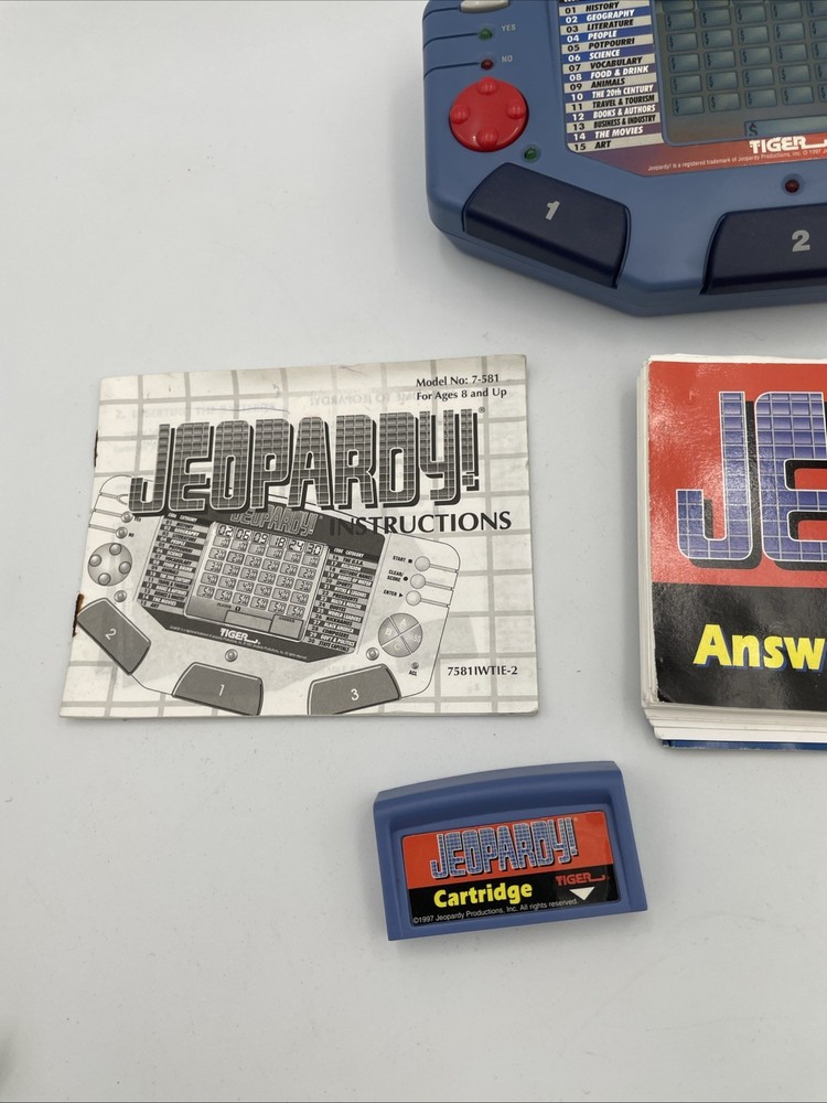 Tiger Electronics Jeopardy Hand Held Game 1995 with Answer Book & Manual E1