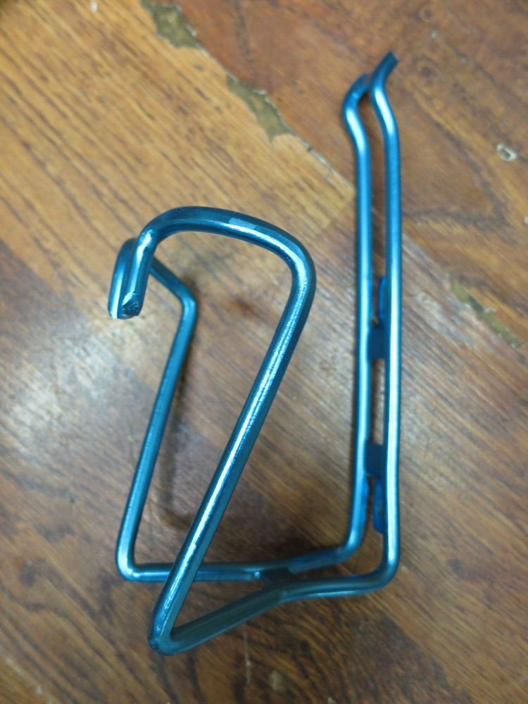 NOS WATER BOTTLE CAGE - TURQUOISE ANODIZED ALLOY