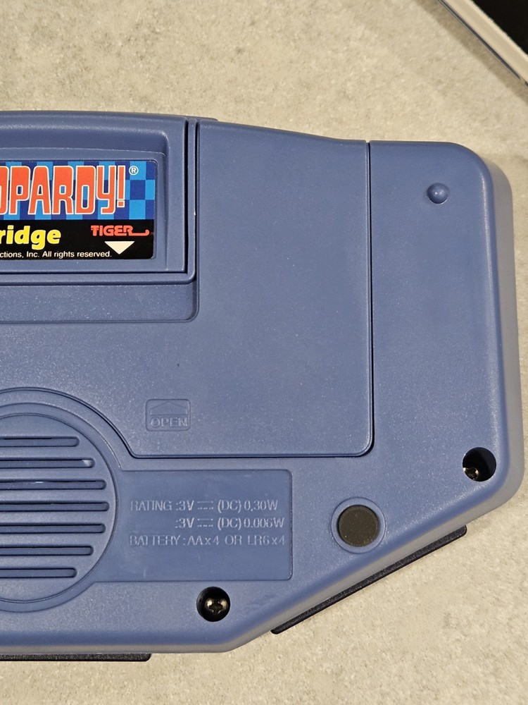 Tiger Electronics Jeopardy Hand Held Game 1995 with Answer Question Book