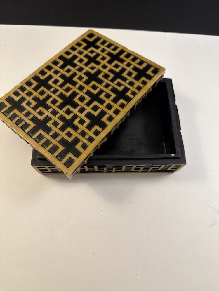 A decorative box with geometric inlay pattern, sold by Sears.