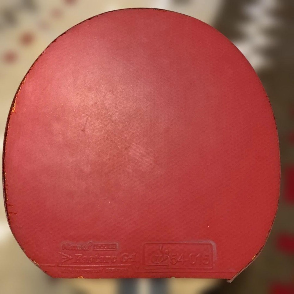 Nittaku table tennis racket red black rubber