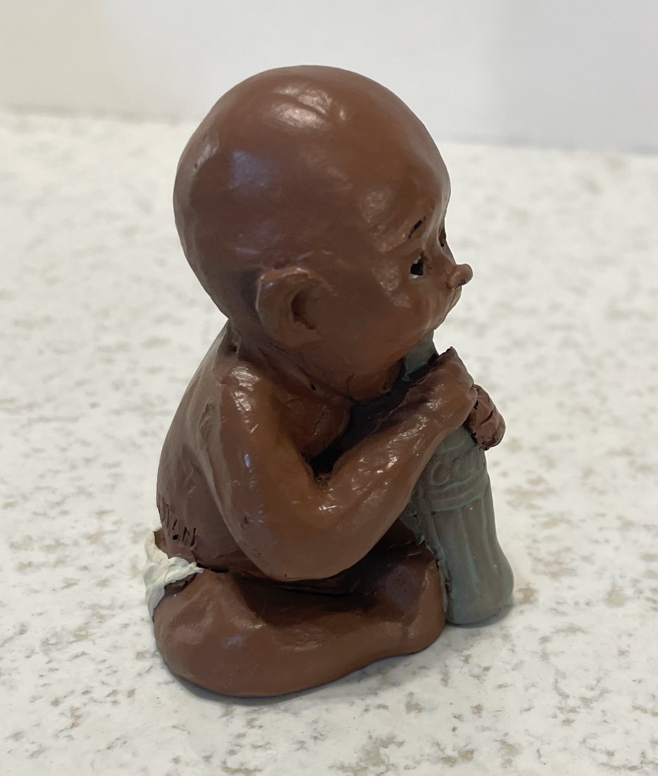 Baby With Coke Bottle 2 1/2” Tall Handcrafted, Signed Figurine