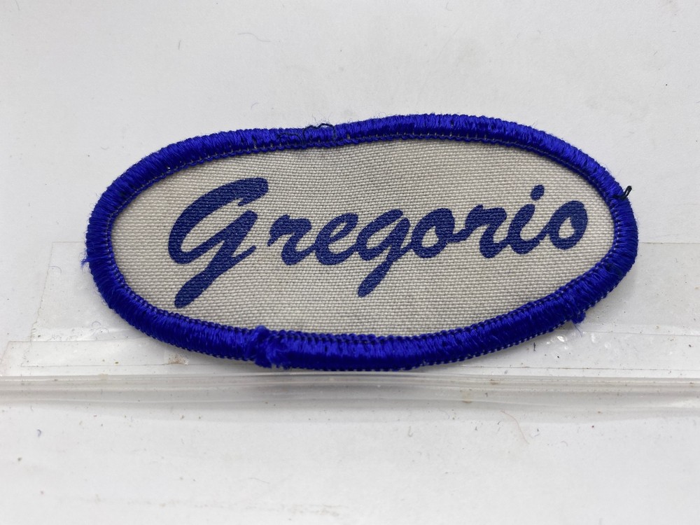 GREGORIO USED SILK SCREEN NAME PATCH TAG OVAL BLUE ON WHITE