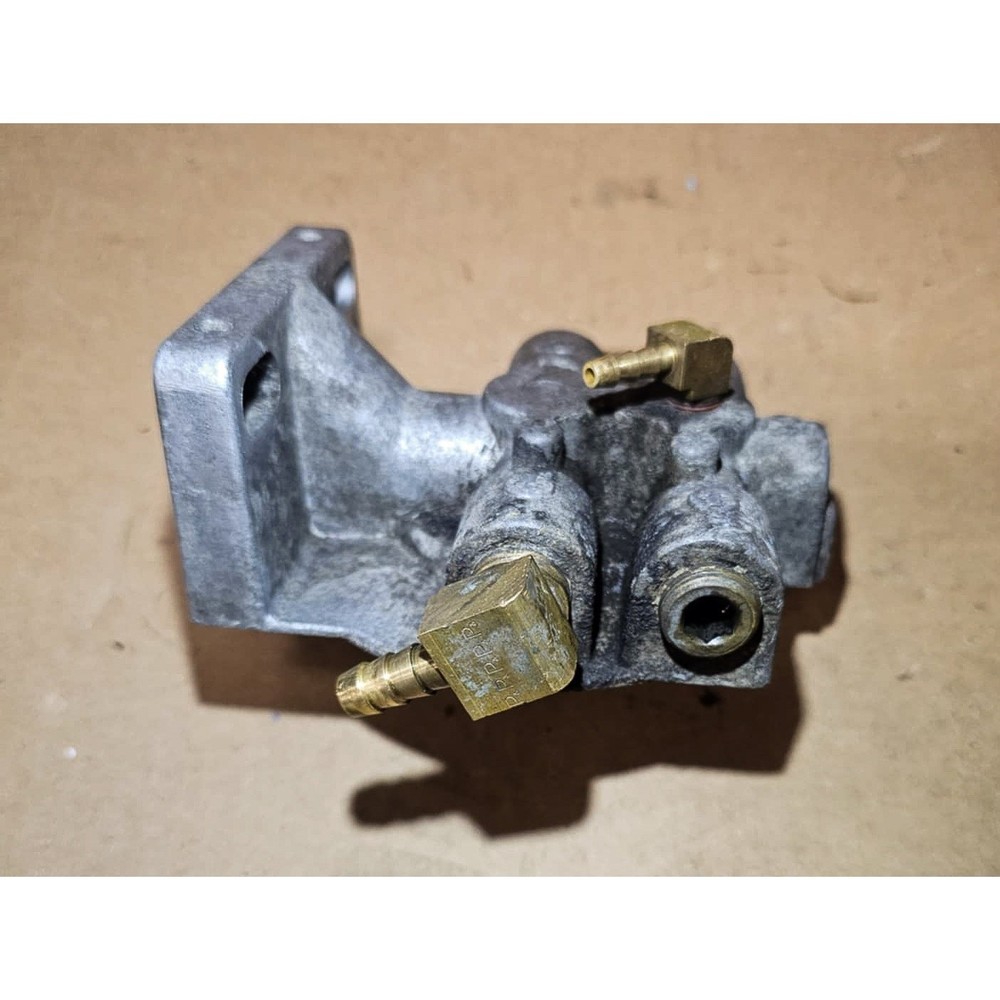 Fuel filter base, 4x 3/8 FNPT barb threads. (324)