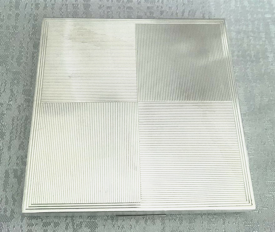 Hallmarked silver compact case with a leather cover
