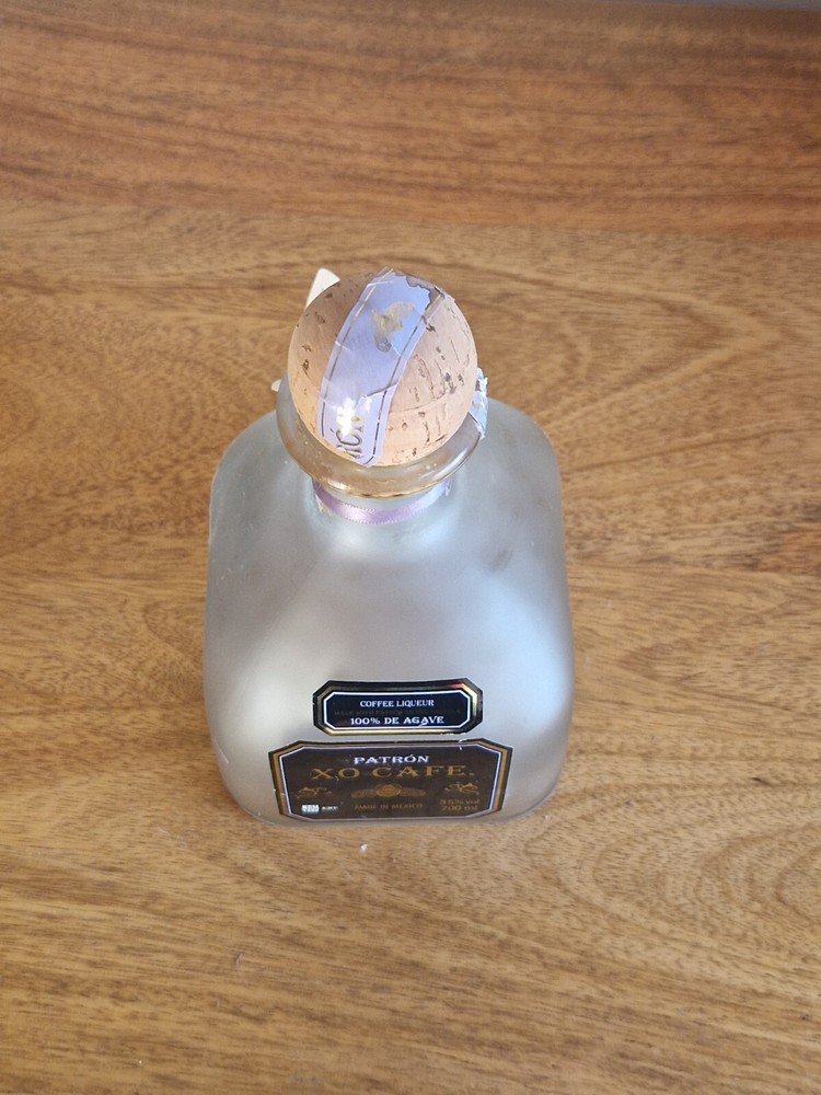 a PAIR of empty PATRON XO CAFE Bottle 700ml with cork