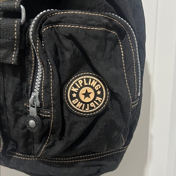 2003 Vintage Kipling Small Black Backpack with Tan Drawstrings