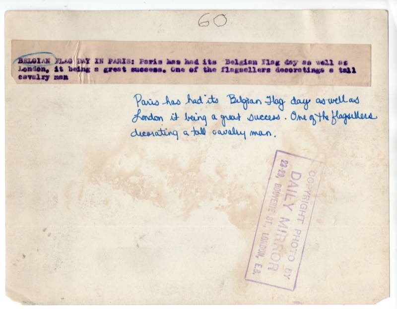 WWI Belgian Flag Day in Paris Woman Decorates Cavalrymen With Flag News Photo