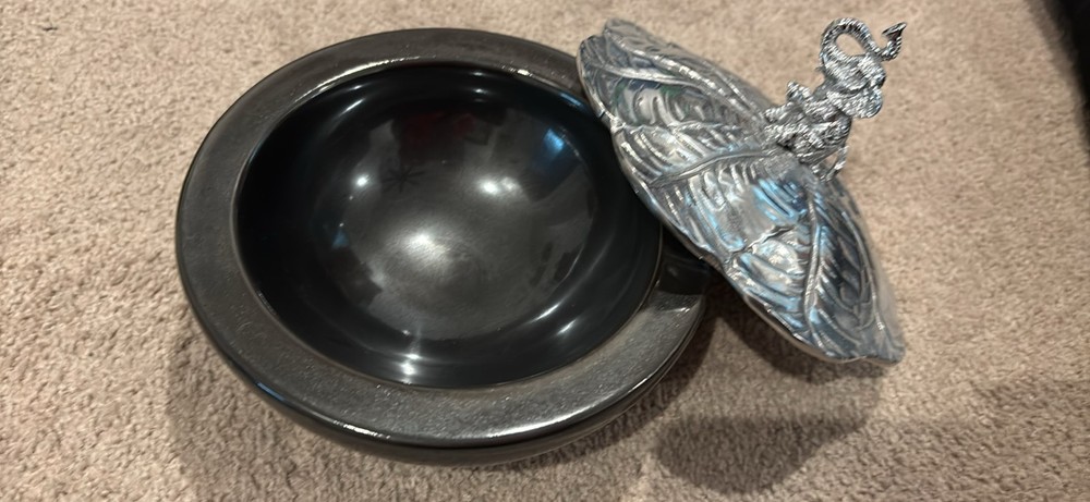 Decorative glass bowl with silver elephant handle lid