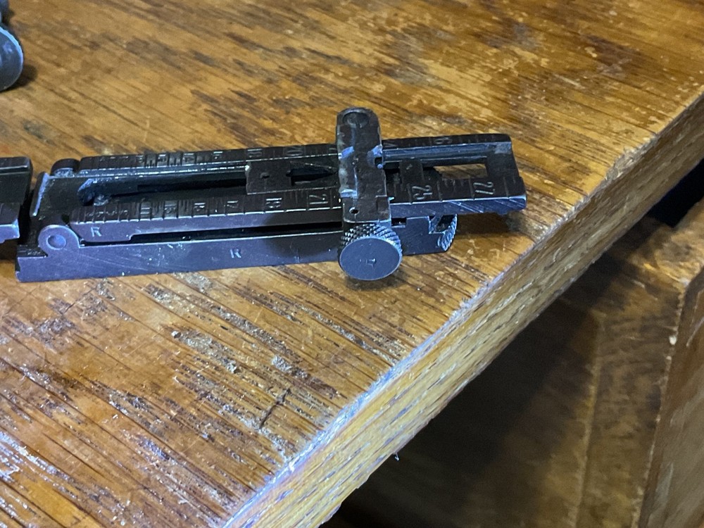 Remington 1903 sight base, leaf, slide, elevation, windage knobs marked R. 1 set