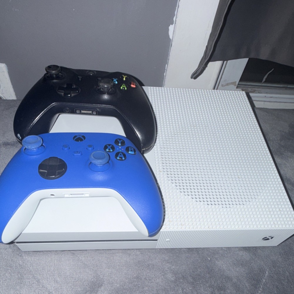 Microsoft Xbox One S Console with Black and Blue Wireless Controllers