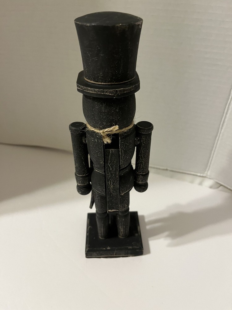 Black washed wooden folk art nutcracker