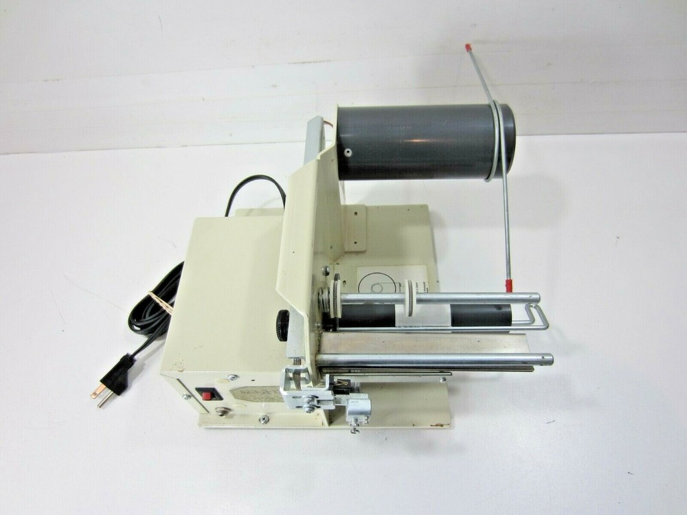 Grip-A-Tab Electric Tape Dispenser Machine