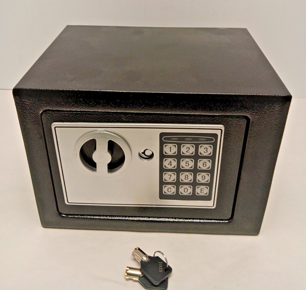 electronic security safe box with a keypad and key access.