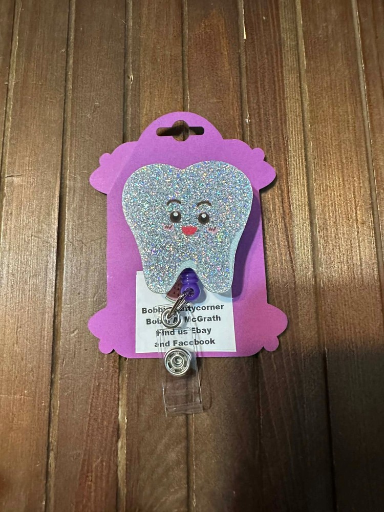 Tooth badge reels