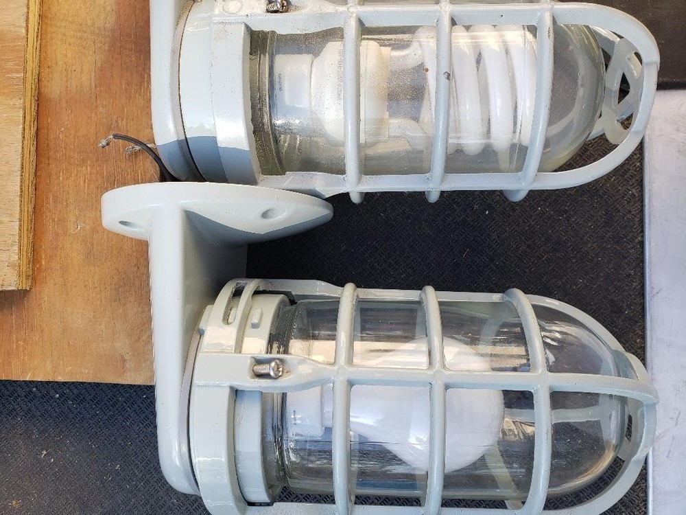 Cage Protected Vapor Tight Protective Light Fixtures.