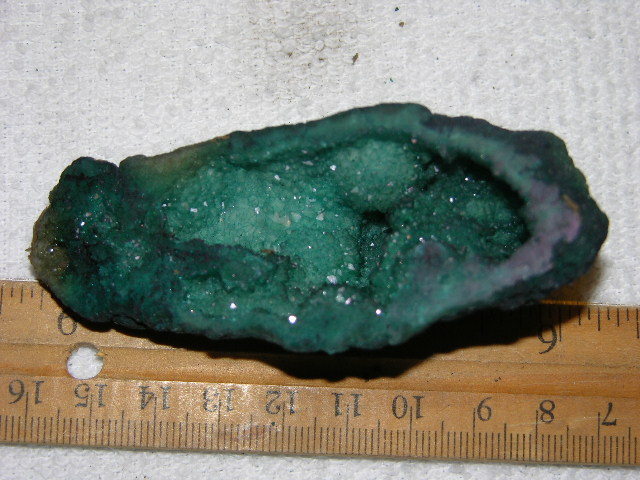 Geode cut & polished half with colored crystal center 3 inch E45