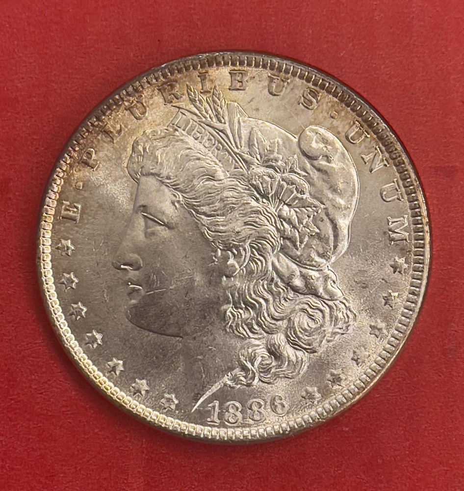 1886 P Morgan Silver Dollar, Gem Uncirculated.
