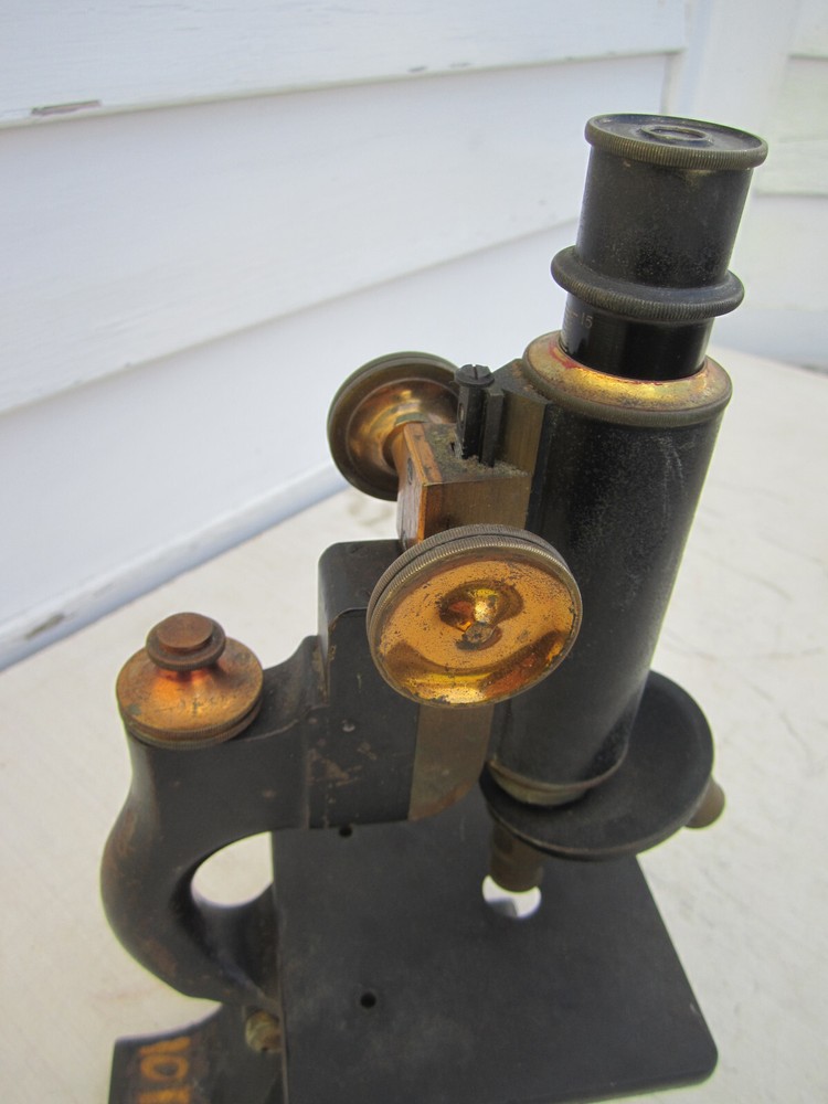 Antique microscope with brass trim