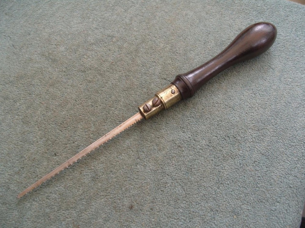 Rosewood handled pad saw.