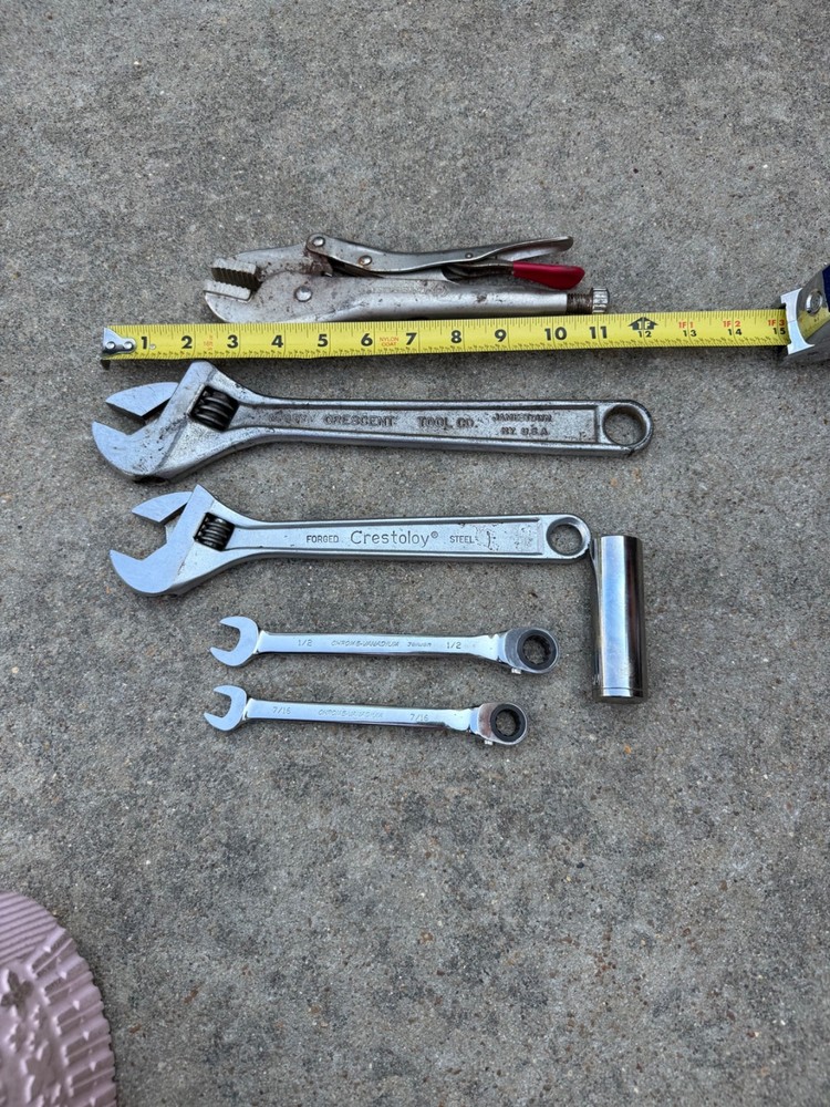 Crescent Tool adjustable wrench, locking plier, two ratcheting wrenches, socket