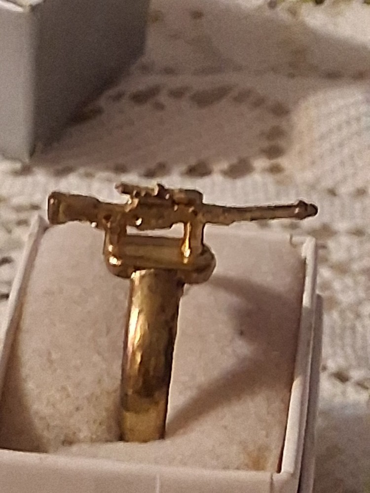 Early 40's to late 50's gold gun ring. Military based