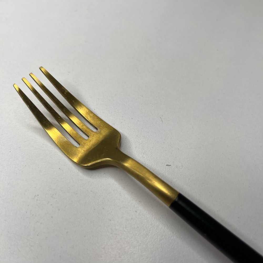 Gold Tone Fork With Matte Black Rounded Handle Modern And Elegant