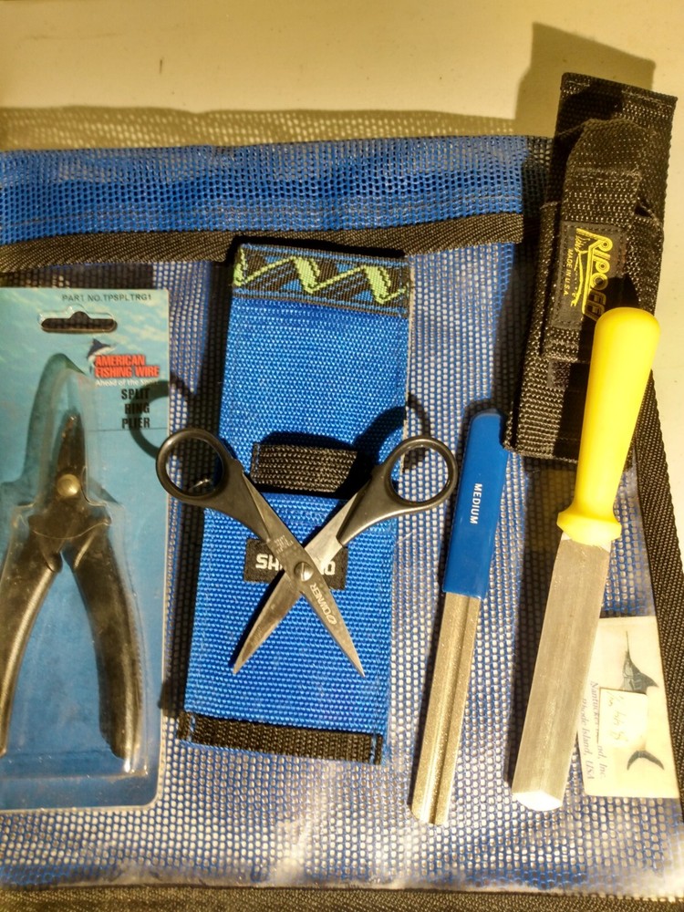 Nantucket bound inc lure bag, shimano scissors, split ring pliers, sharpener.