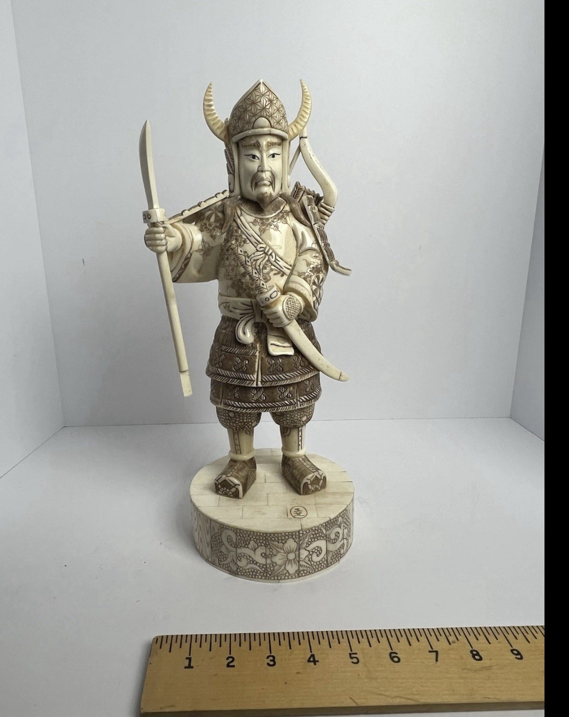Japanese carved  figure is a warrior.
