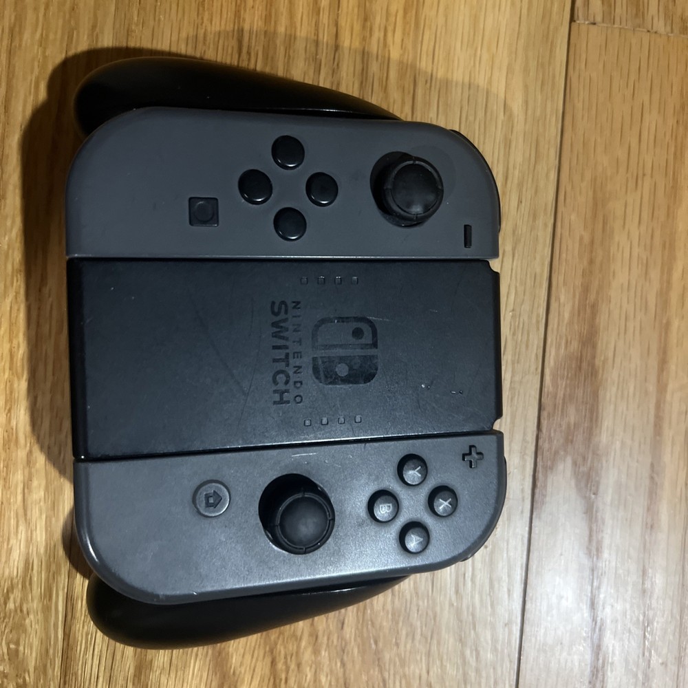 Nintendo Switch Console W/ Dock, Joycon Grip, & Joycons “READ”