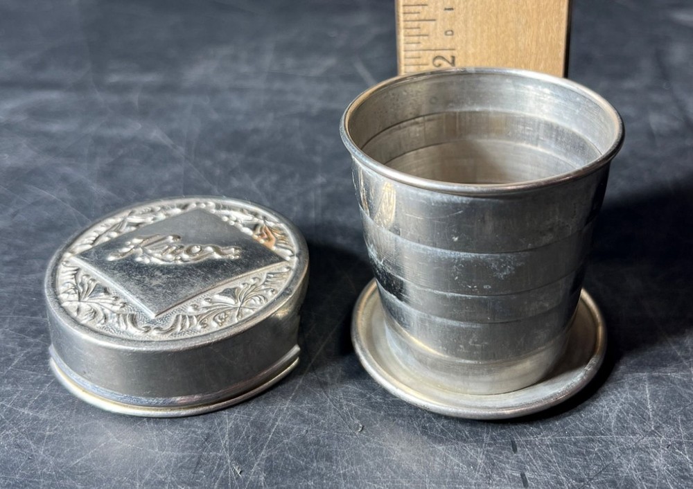 A Pardee collapsible cup, marked 'Made in USA' on the base