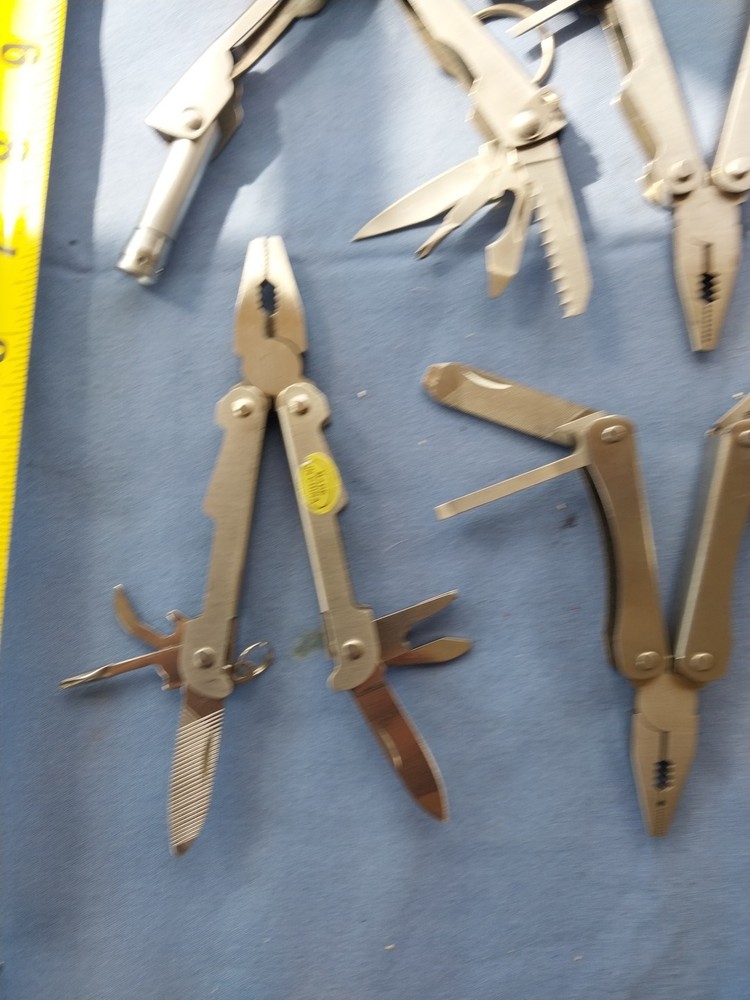4 small multitudes with pliers knife scissors screwdriver's