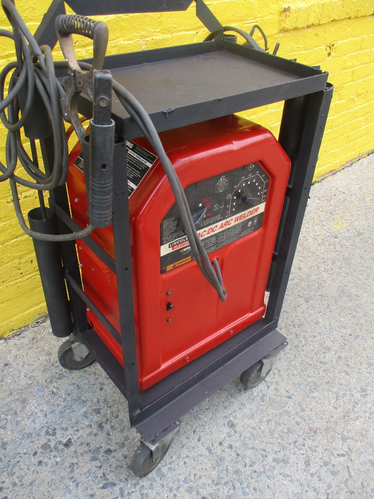LINCOLN AC/DC 225 ARC WELDER on CART w/25ft of CABLES