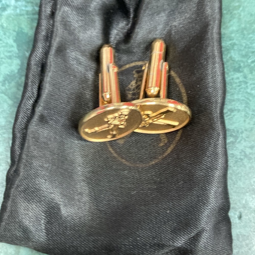 Gold tone cuff-links walking man