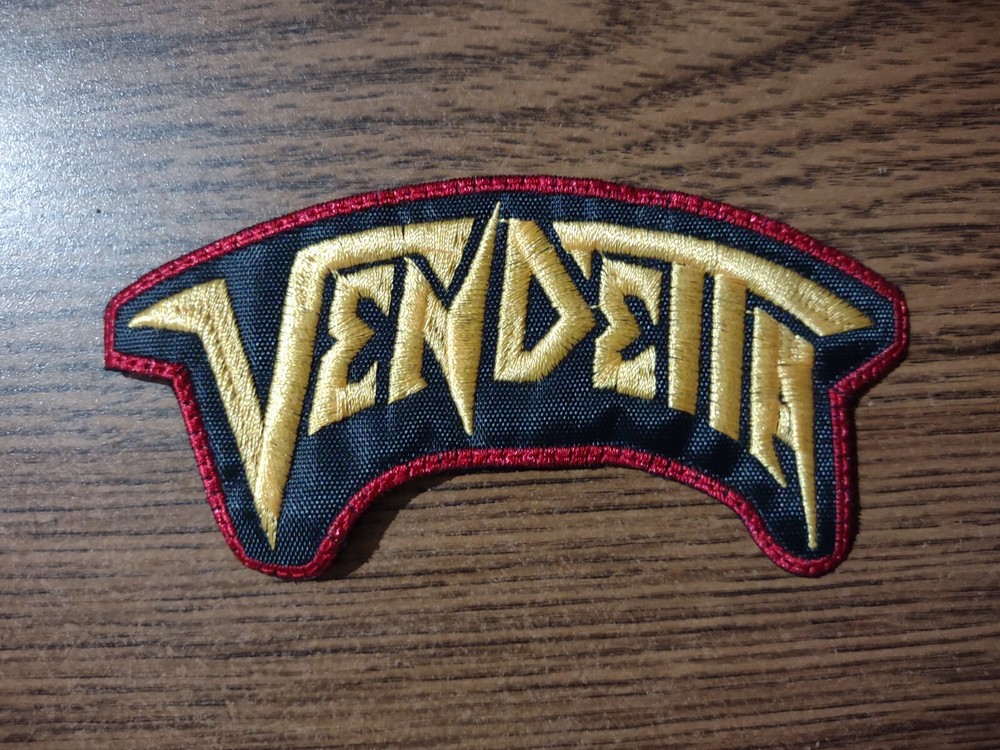 VENDETTA,SEW ON GOLDEN WITH RED BORDER EMBROIDERED PATCH