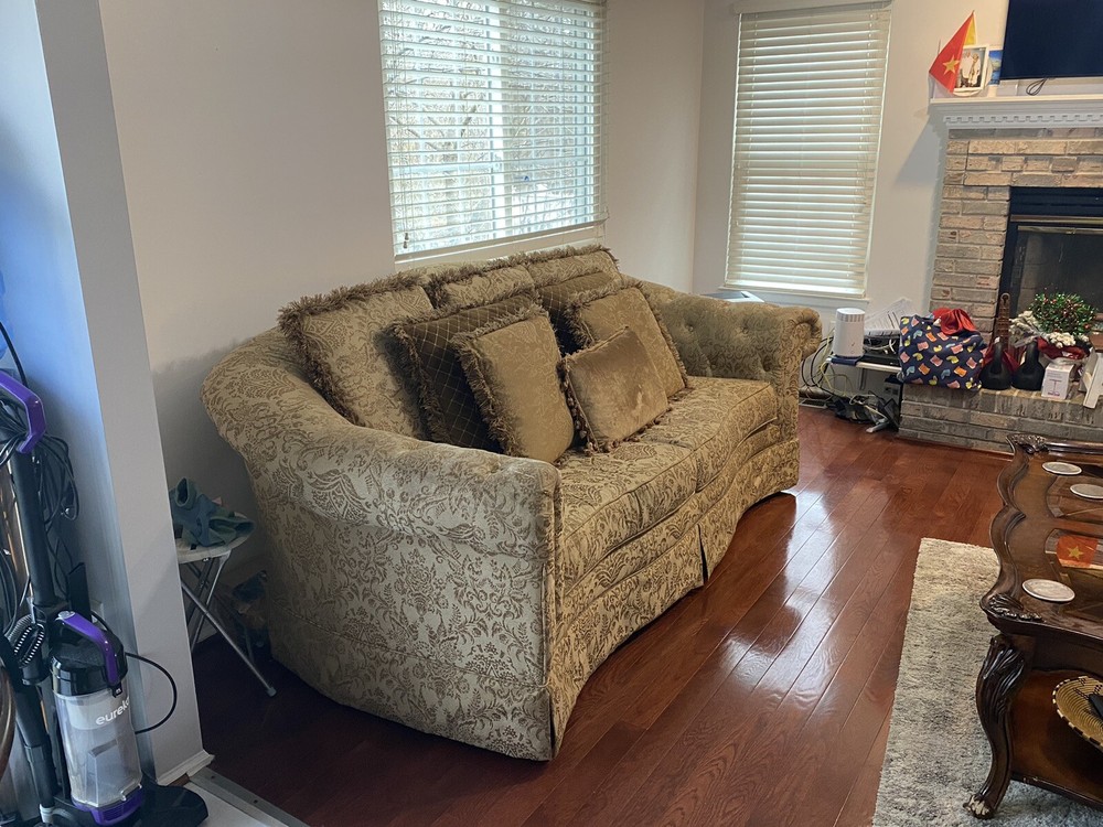 A Set Of Beige Sofas And A Coffee Table