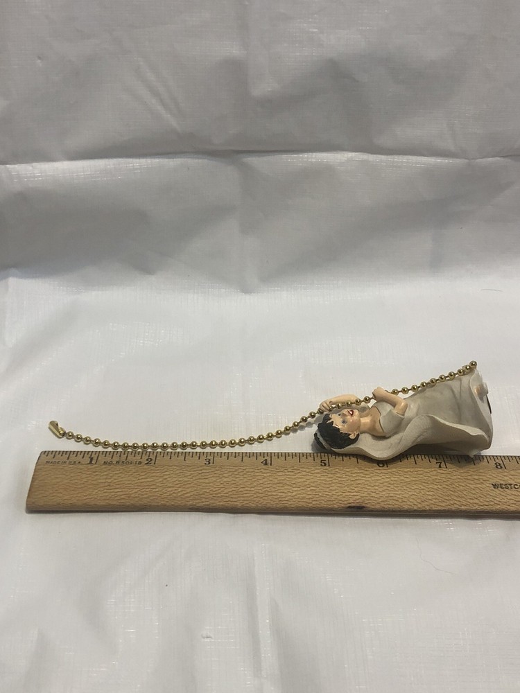 A Decorative Ceiling Fan Or Light Pull Ball Chain With Bride