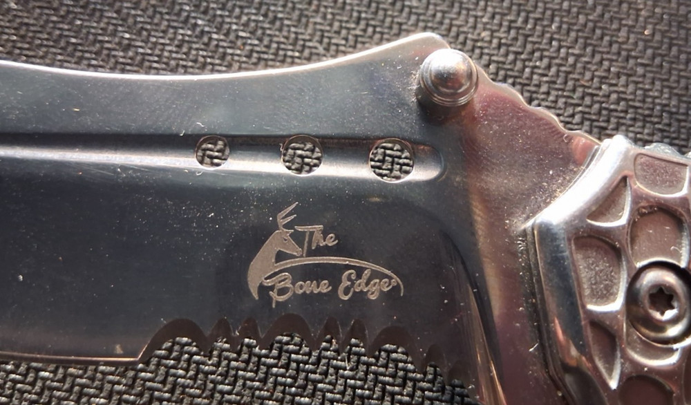 The Bone Edge Damascus Folding Knife