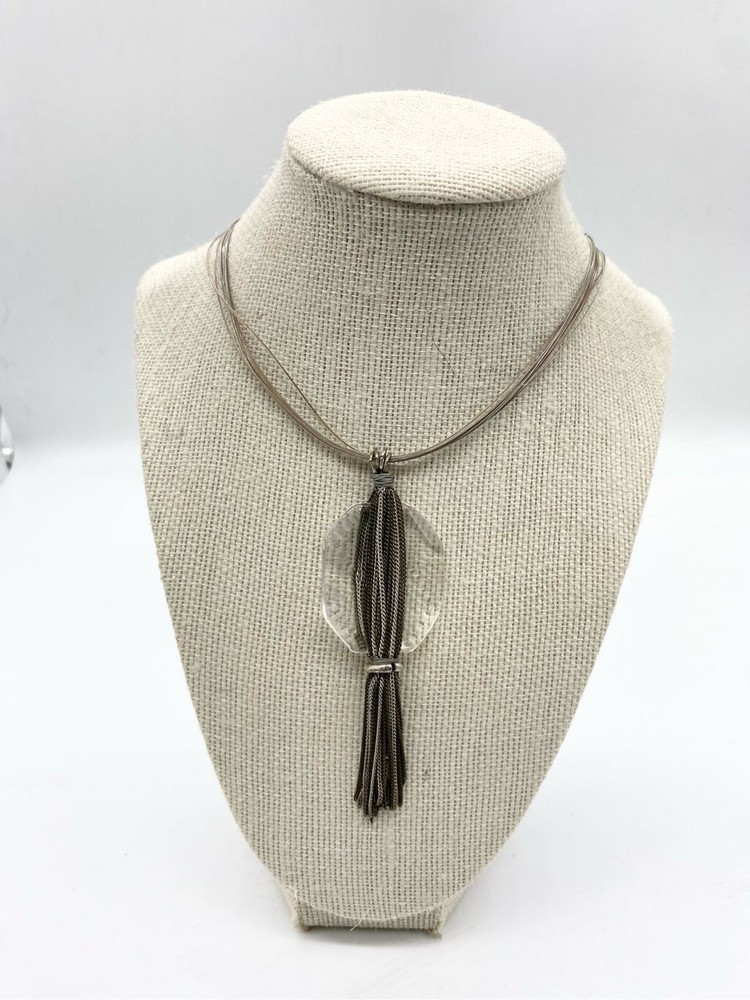 Clear large glass stone with multi layered chain silver tassel