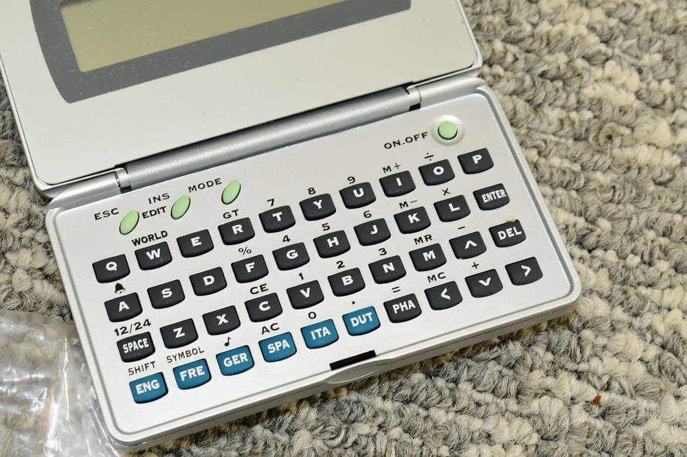 Generic Electronic Language Translator Handheld Computer - Needs New Batteries