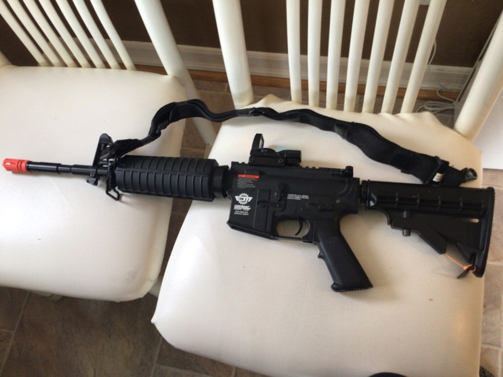 Combat Machine Airsoft 6mm pellet AEG semi/auto system with red dot scope